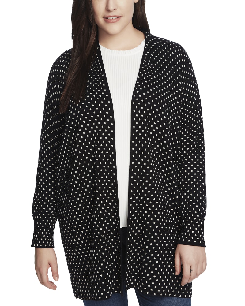 Front of a model wearing a size 1X Evie Polka Dot Cardigan in 060-RICH BLACK by CeCe. | dia_product_style_image_id:263377